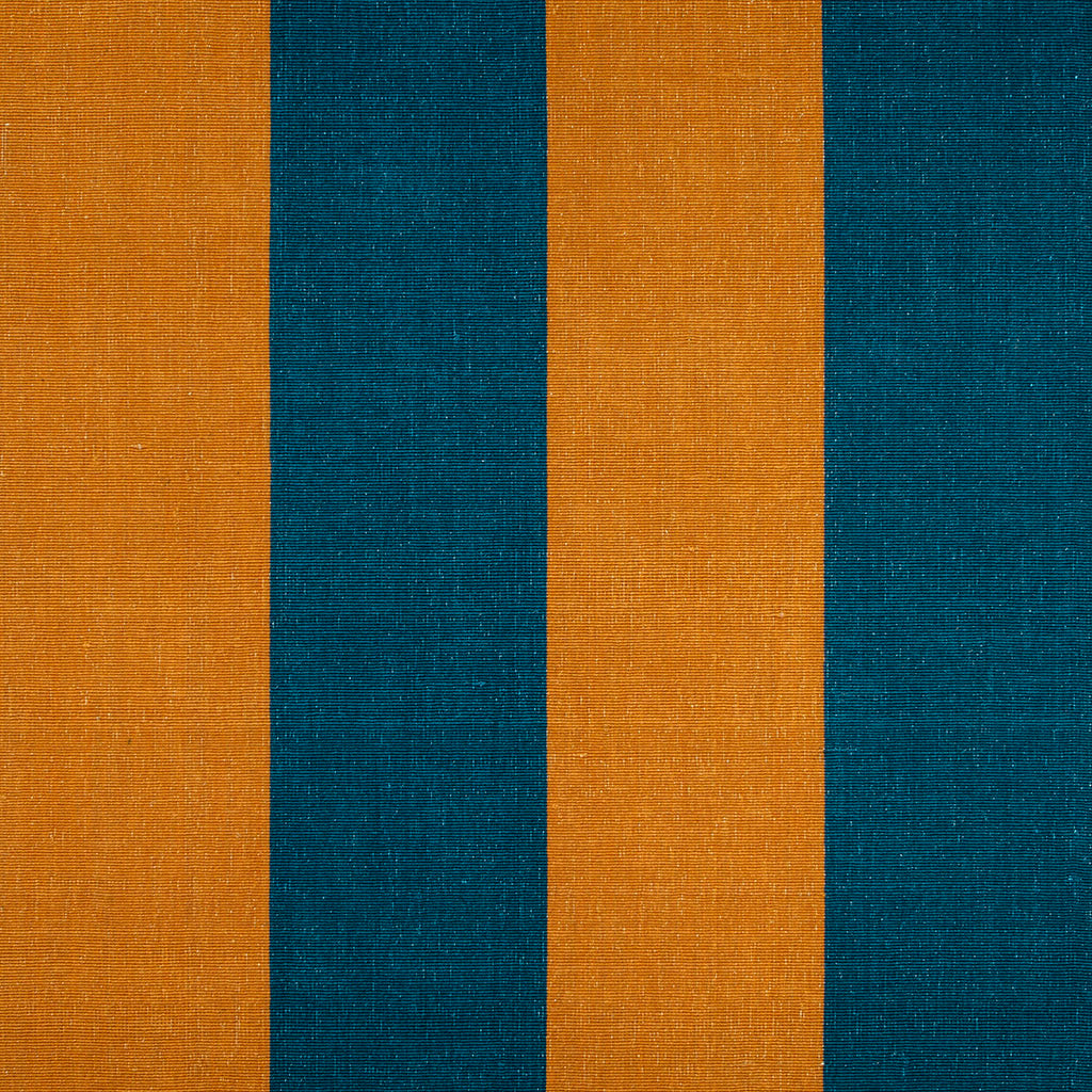 A small square sample of our burnt orange and navy blue wool rugs and runners. This includes a wide range of striped, flatweave and heavyweight styles made from ethically sourced New Zealand wool. 